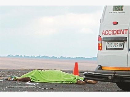 The lifeless body of a mother and her child was part of the scene of destruction left after a car collided with a truck on the N4. PHOTO: Jana Boshoff.