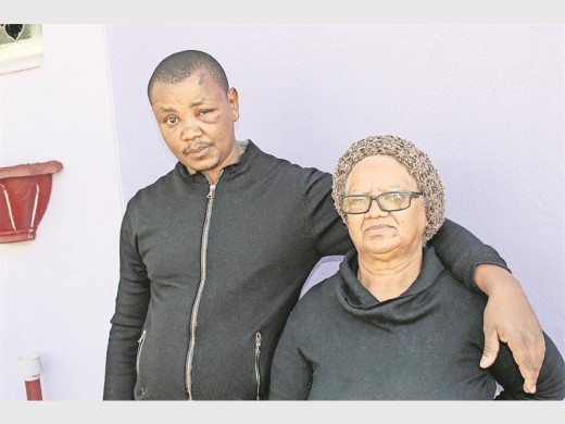 Solomon Maisela with his mum, Maria. He sustained injuries to his forehead and face and required stitches. Maria says that she's been sworn at and fears David.