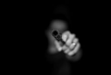 max-kleinen-ugdKmhDg1m8-unsplash gun hijack criminal
