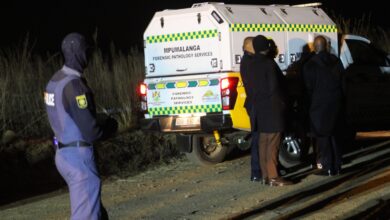 Forensic pathology vehicle removing a dead body.