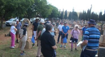 The group listens attentively to Theo Ligthelm.