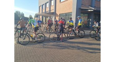 Cyclists on their bikes ahead of race.