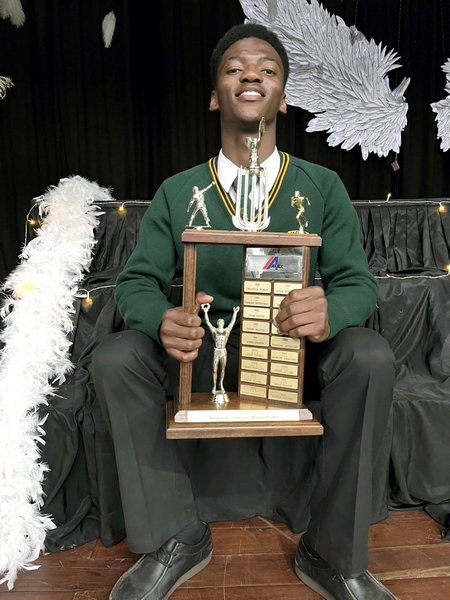 Boy with trophies at Hoërskool Middelburg prizegiving.