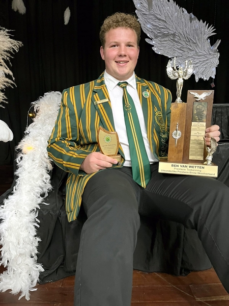 Boy with trophies.