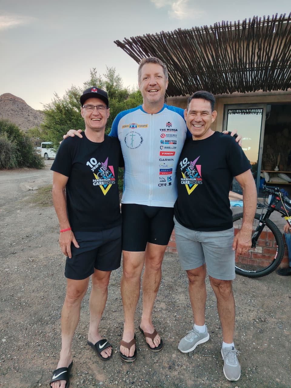 A picture of Corné Ferreira, Springbok lock Bakkies Botha, and PC Nell of Care Riders 1.