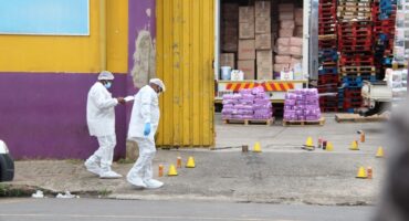 Forensic team on a scene where security guards were shot.