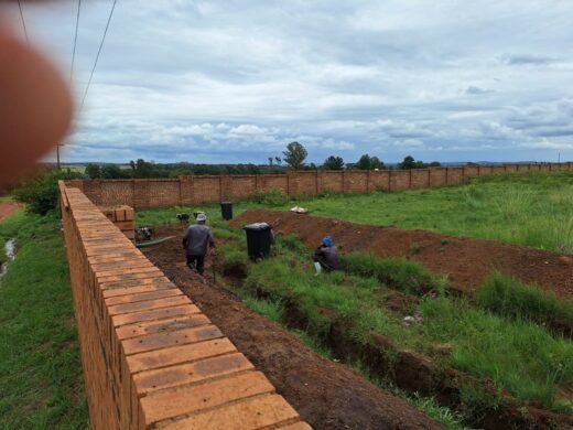 Workers digging trenches.