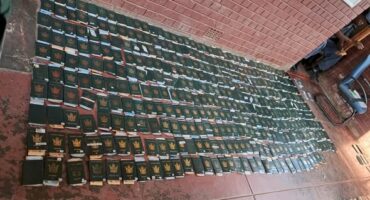 A photo of multiple passports confiscated by the police.