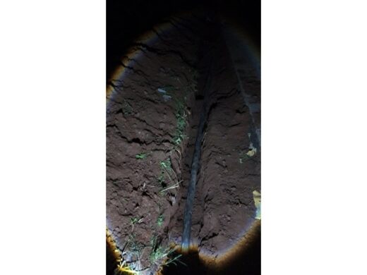 The trench with the cable in it.