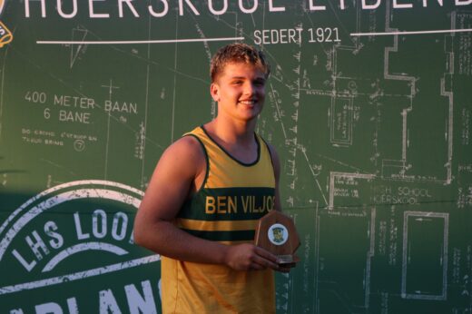 A young athlete in a yellow and green sports jersey holds a trophy, smiling proudly. He stands before a green background with white text and diagrams.