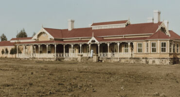 An old photo of Middelburg Hospital, showcasing its large, historic architecture