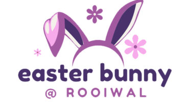 Logo of an Easter bunny adorned with flowers and large ears, representing the joy of the holiday season.