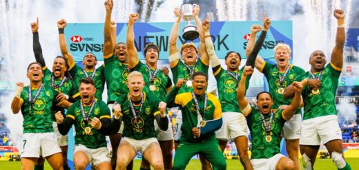 The South Africa rugby team rejoices, lifting the trophy high after their victorious match celebration.