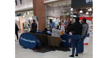 Nursing staff from Life Midmed Hospital standing at a table during a kidney screening day.