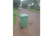A green wheelie bin.