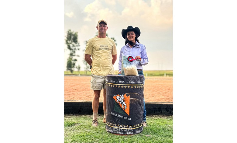 A man and woman with a trophy.