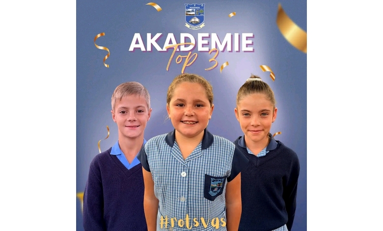 Three smiling children in school uniforms stand against a blue background with golden confetti. Text above reads "Akademie Top 3" and "#rotsvs".