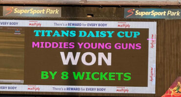 Scoreboard at SuperSport Park displays "Titans Daisy Cup: Middies Young Guns Won by 8 Wickets." Bold text, celebratory colors, reflects victory.