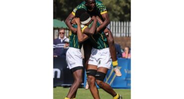 Rugbyspelers vier drie.