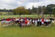 'n Groep gholfspelers.