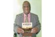 Former mayor Ben Mokoena with his book. PHOTO: Ben Mokoena