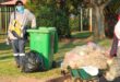 A green wheelie bin.