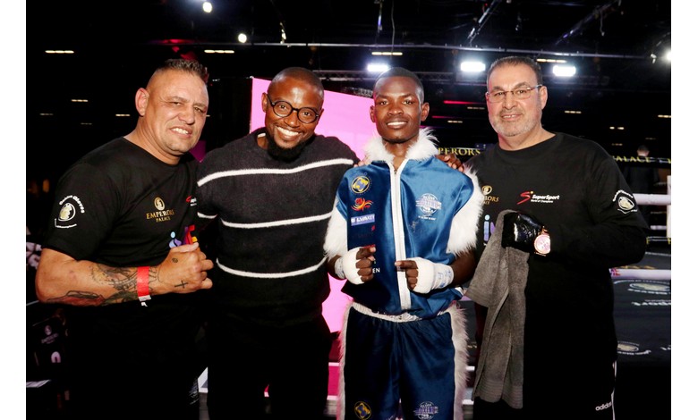 A boxer with his trainers and managers.