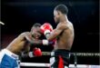 Two men boxing.