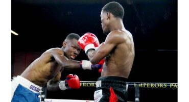 Two men boxing.