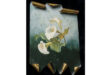 Painting of white calla lilies on a brass sheet with curled edges, set against a soft green background. The tone is serene and elegant.