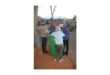 Children gathered at a dustbin.