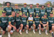 A group of young men wearing green and yellow uniforms, standing together in a team formation.