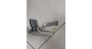 A handgun with ammunition.