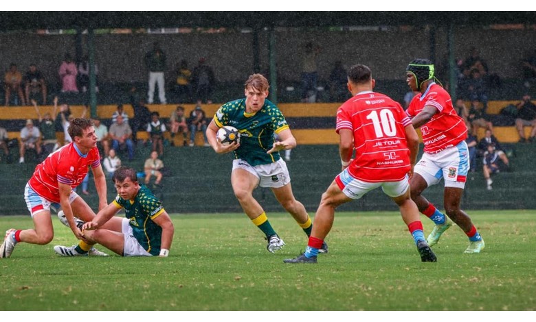 Die seun op die rugbyveld.