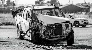 Heavily damaged white bakkie following a collision at the Acasia stop outside Ermelo