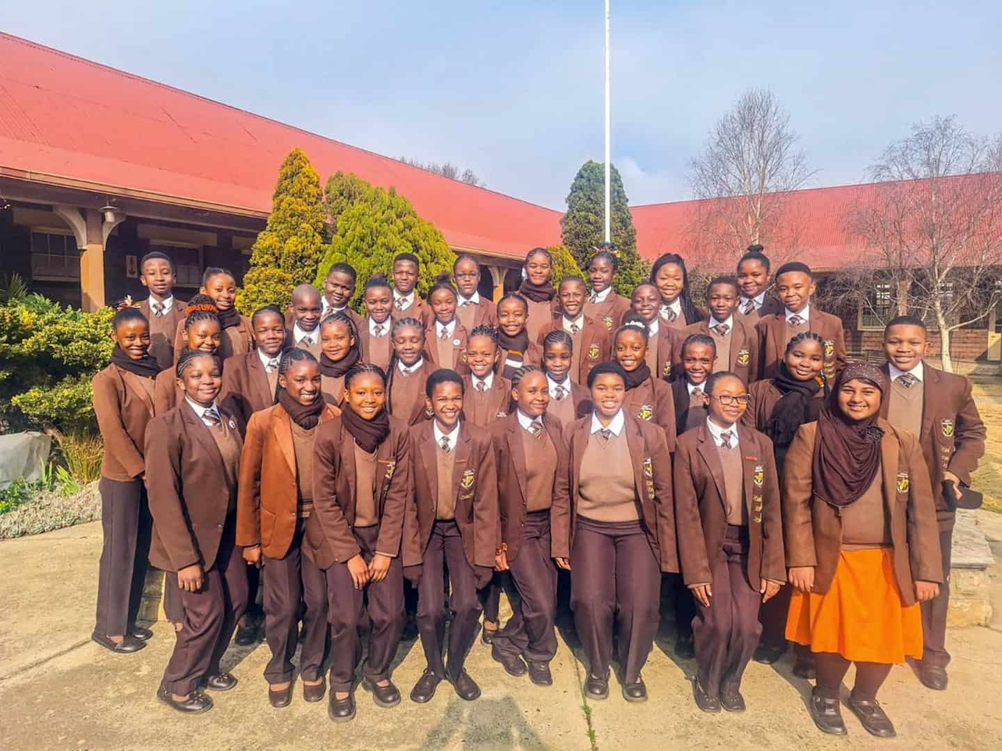 Ermelo English Primary School’s Grade 6 high achievers for Term 2, posing with certificates or awards.