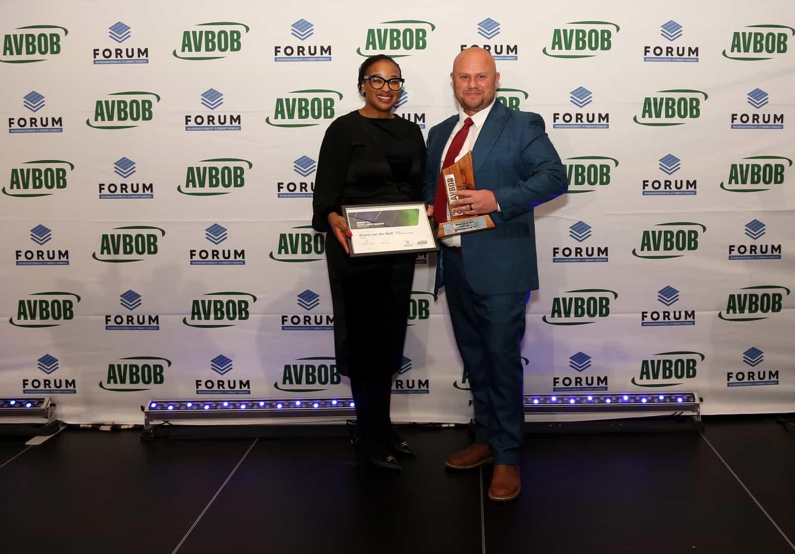 Nakedi Pilane congratulates Highvelder editor Wayne van der Walt, winner of the Photographer of the Year award for the third year at the Avbob FCJ Excellence Awards.