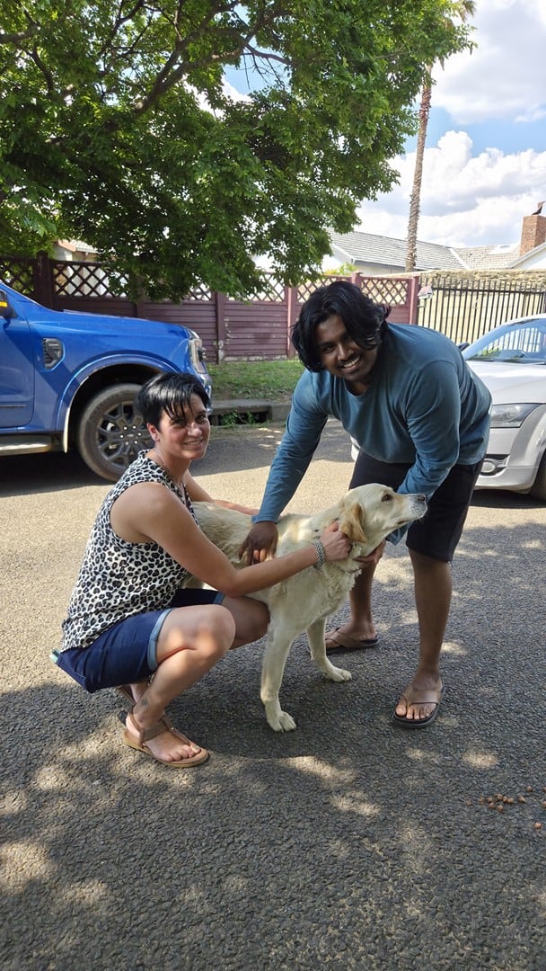 Angela van Huyssteen and Gareth Chetty with Apple, the rescued dog, after she was pulled from a stormwater drain in Ermelo.