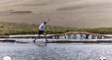 Wieste van der Westhuizen maintains balance while crossing the water bridge at the Glen Aggy Trail Run.