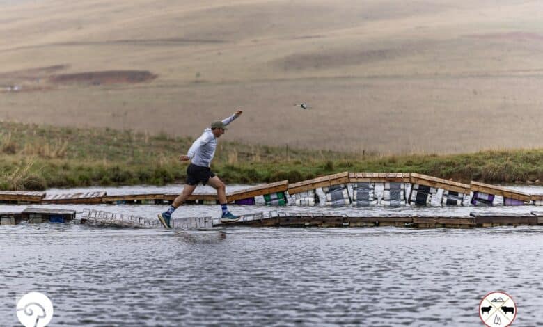 Wieste van der Westhuizen maintains balance while crossing the water bridge at the Glen Aggy Trail Run.