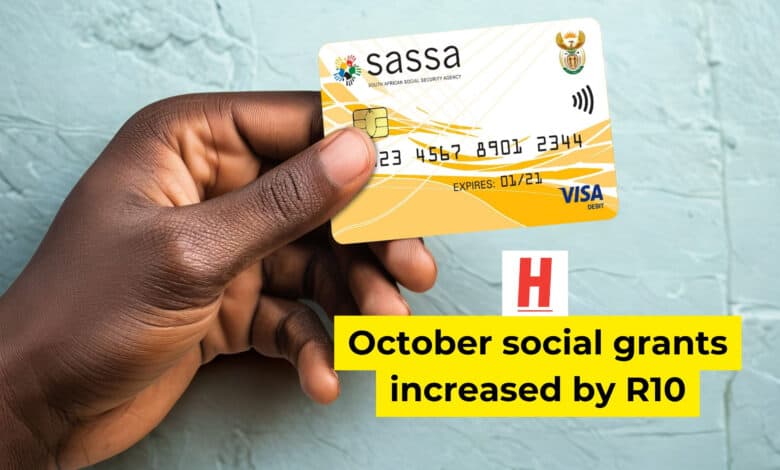 Person holding a yellow SASSA social grant payment card in South Africa.
