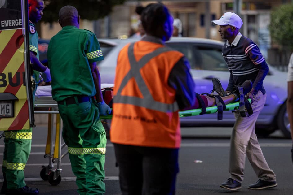 Paramedics load an injured woman into a provincial ambulance after she was struck by a taxi near the Pick n Pay traffic light in Ermelo.