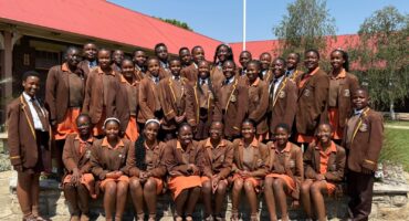Grade 7 learners from Ermelo English Primary School proudly display their Term 3 achievement certificates.