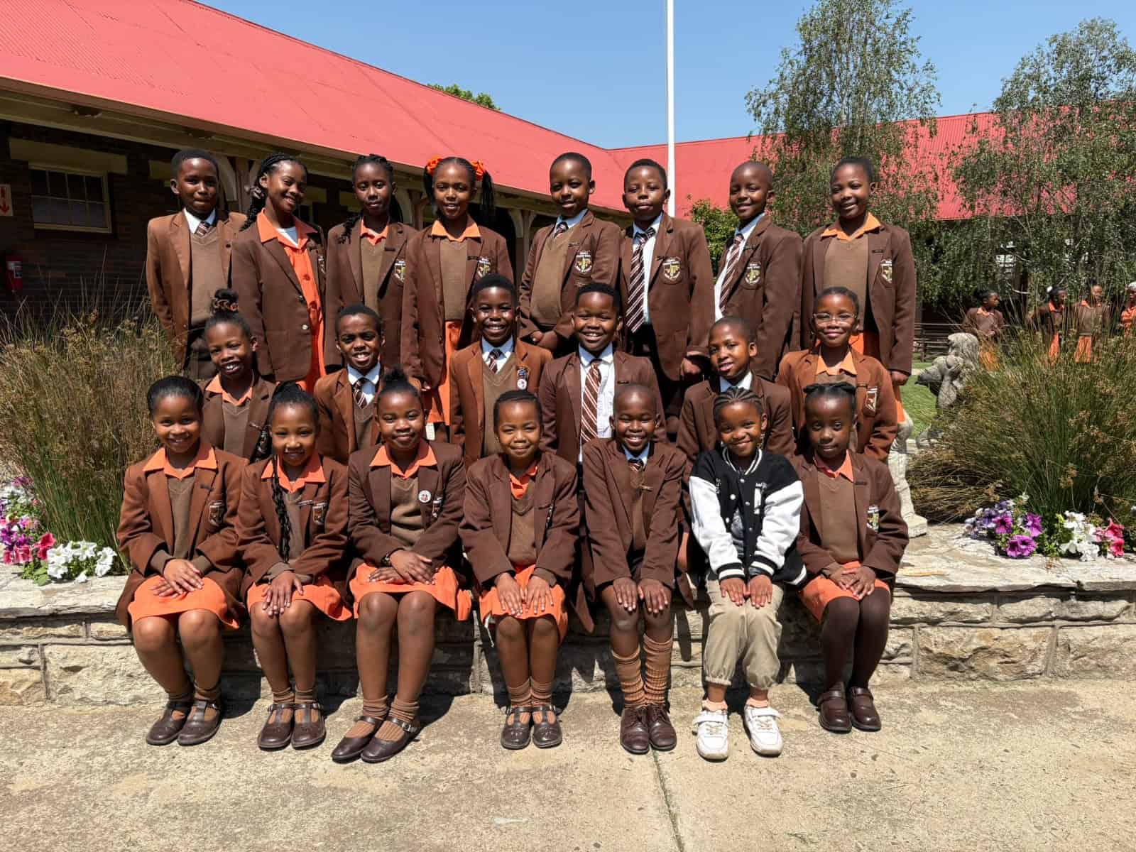 Grade 4 achievers from Ermelo English Primary School proudly display their Term 3 certificates.