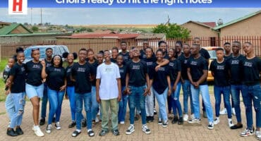 Group photo of the Breyten Youth Choir standing together and smiling.