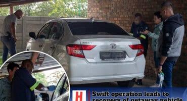 Police and forensic officers inspect a silver Honda sedan recovered in connection with the Ermelo Jewellers armed robbery.