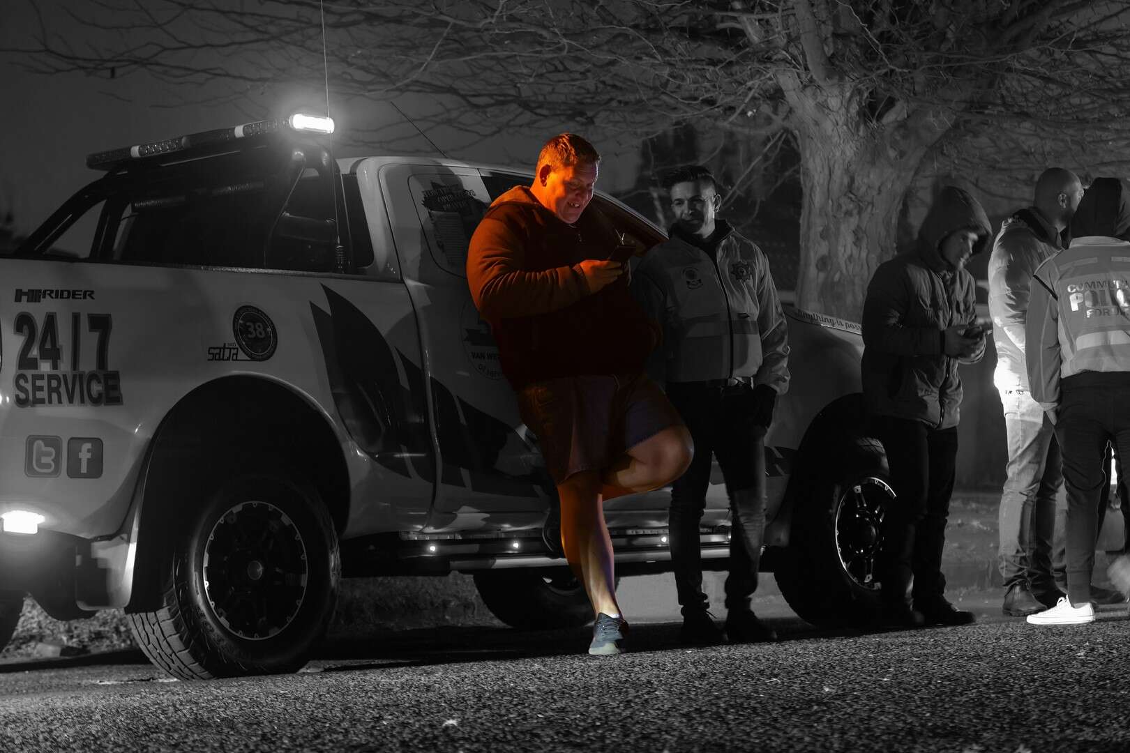 JP Strydom at an accident scene late in the evening, assessing the situation under low light.