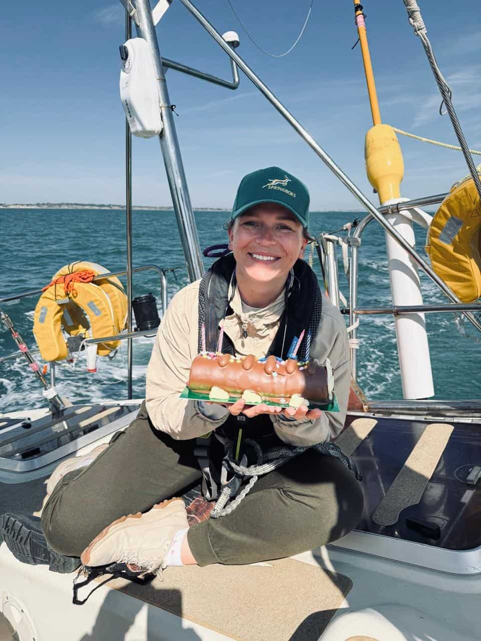 Bobby Van Strijp celebrating her birthday onboard a Clipper Round the World yacht, with a “Colin, the caterpillar” cake, during a training week.
