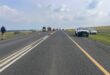 Distant view of a head-on collision on the N11 near Ermelo, showing wrecked vehicles and the roadway.