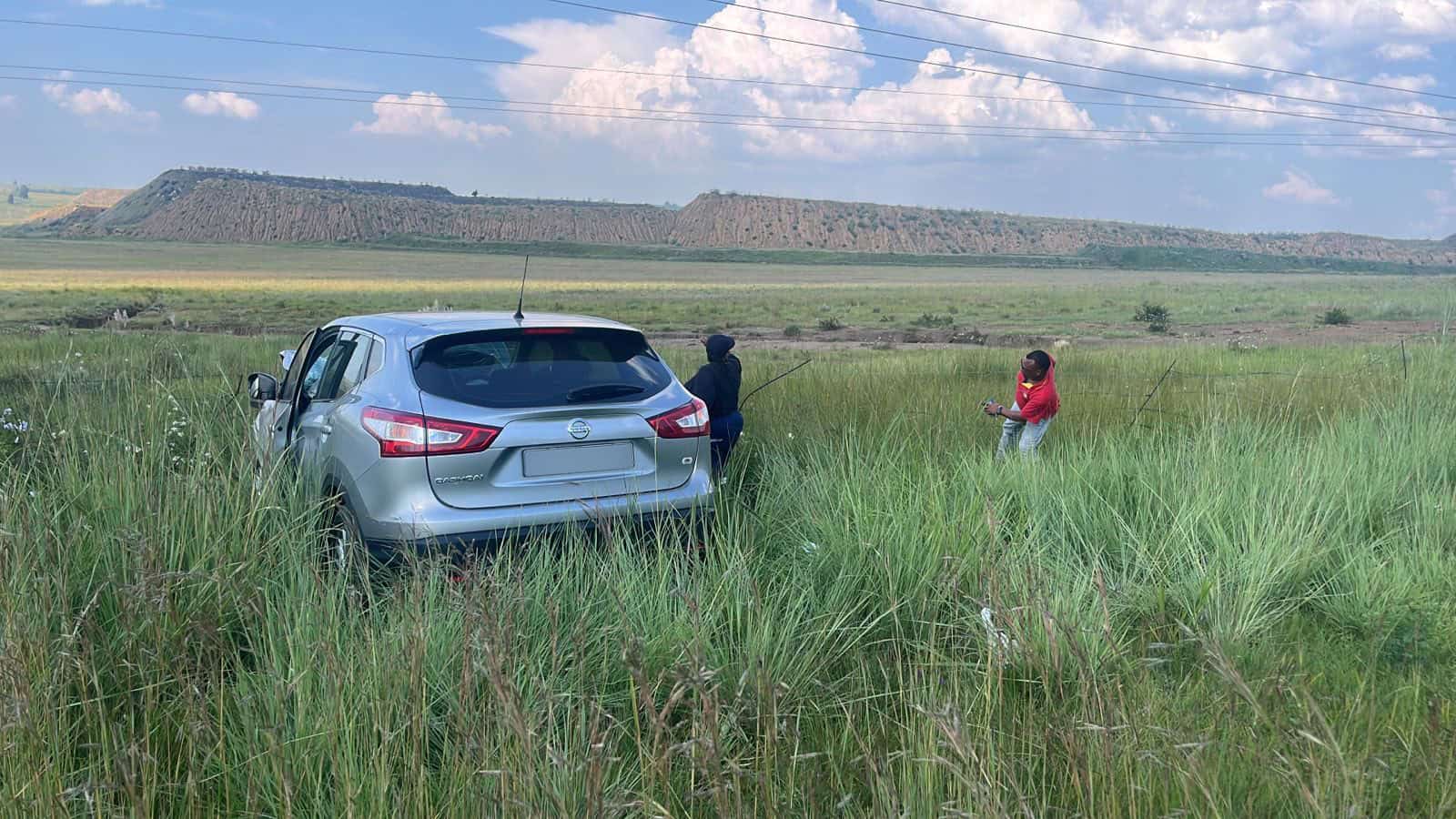 A light motor vehicle in a field on the N2 near Camden Power Station after an accident.